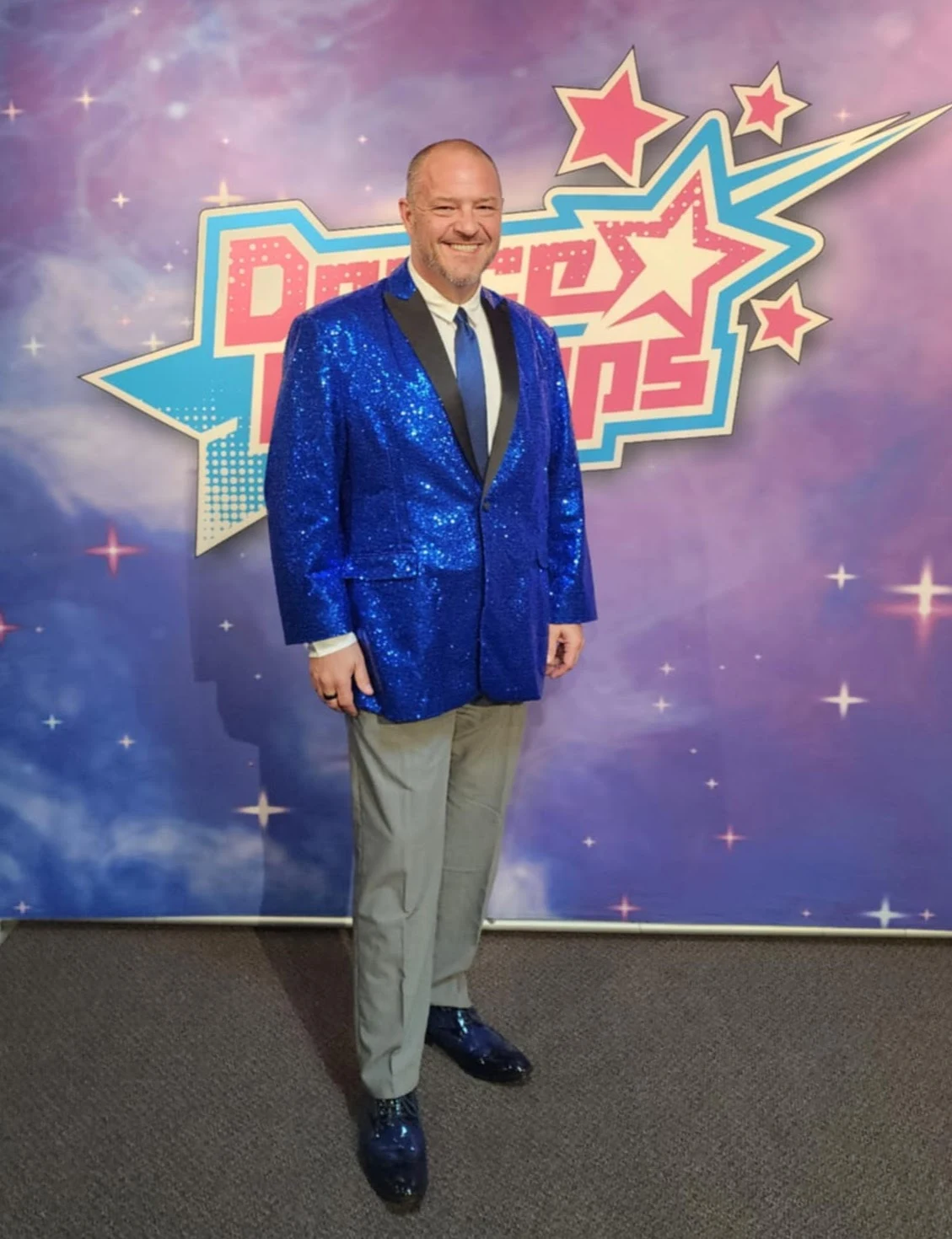 Chris Kamler in a blue jacket at Dance Champs