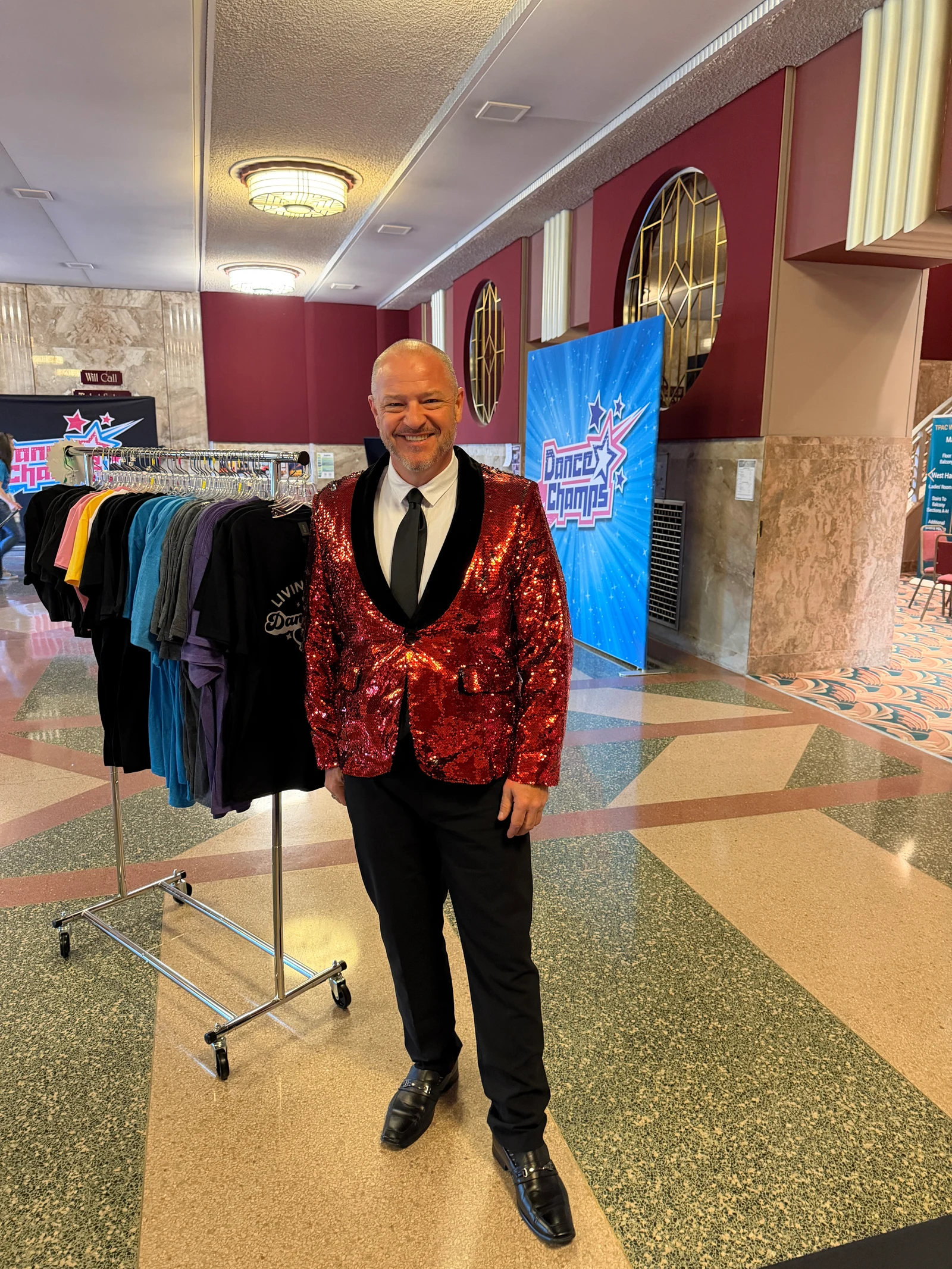 Chris Kamler in a red jacket at a Dance Champs event