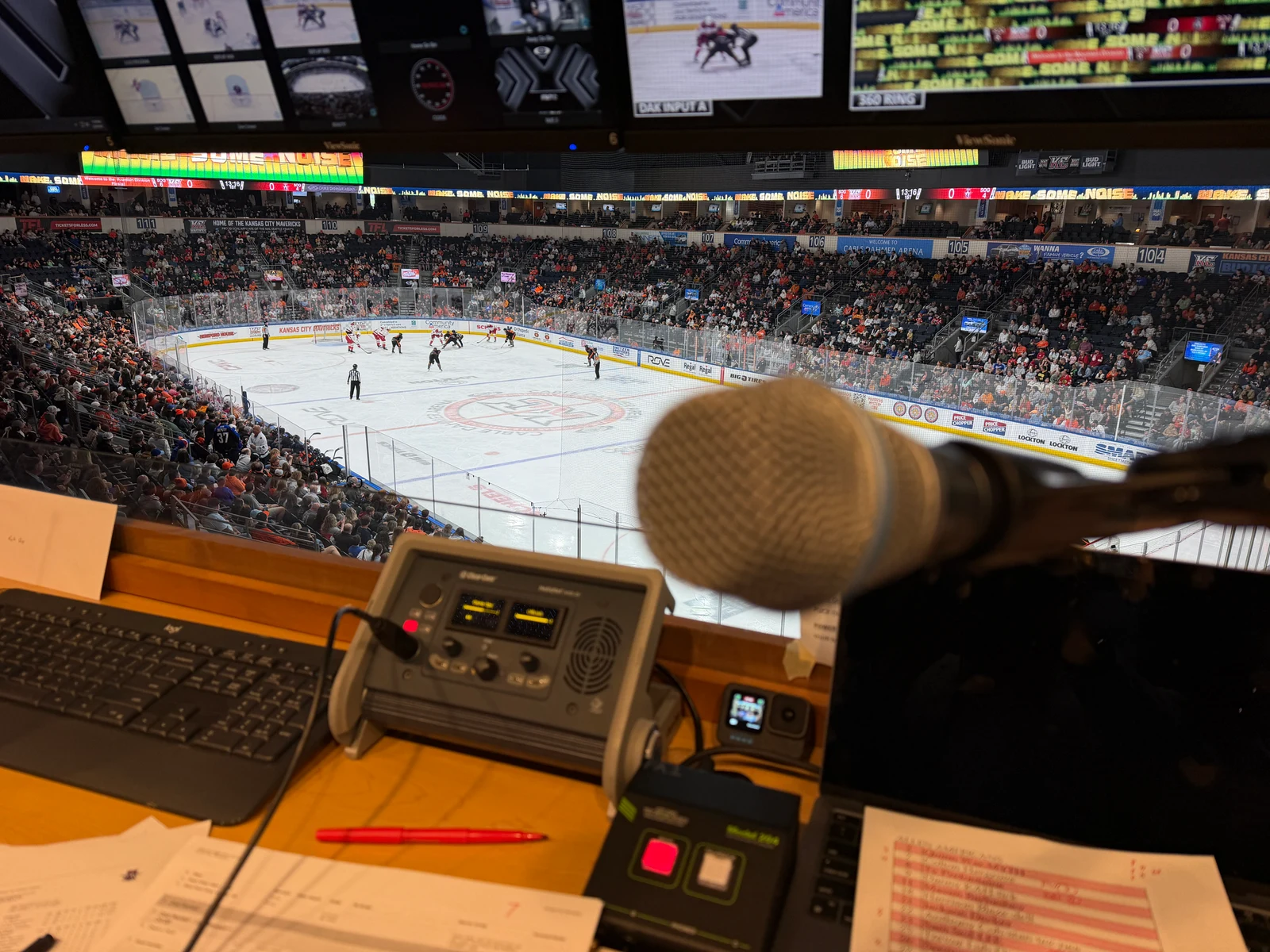 Microphone and announcing equipment overlooking a hockey rink