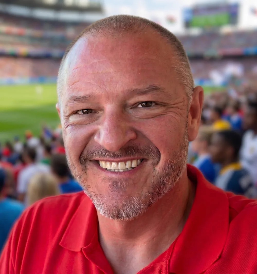 Chris Kamler smiling at a ballpark