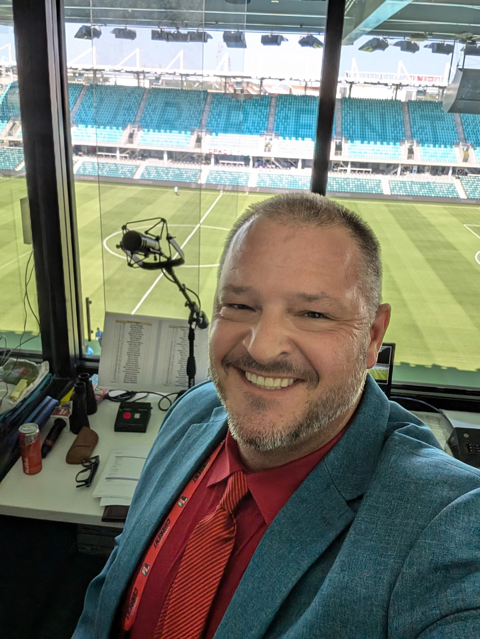 Chris Kamler in the booth overlooking a soccer field